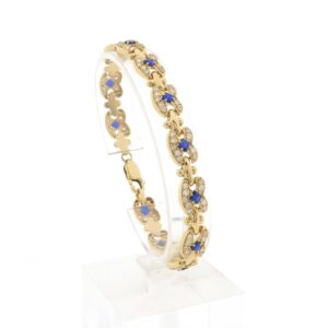 14 karaat geelgouden armband gezet met heldere en blauwe zirconia stenen