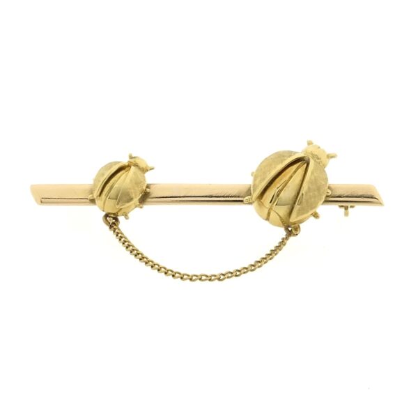 18 Krt. Gouden broche met lieveheersbeestjes