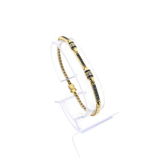 14 karaat geelgouden armband met totaal 0,03 ct. diamanten en saffieren