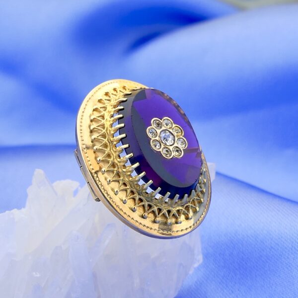 Gouden broche met amethist en zirconia