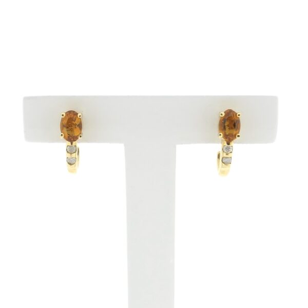 14 karaat gouden oorstekers met citrien en diamant | 0,08 ct.